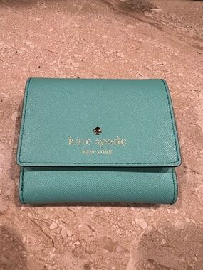 kate spade teal/turquoise leather compact wallet with gold logo